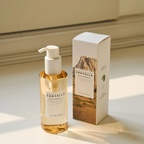 Skincare bottle and packaging on a light surface