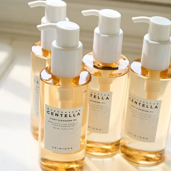 bottles of Centella cleansing oil with pump dispensers